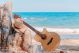 Summer Travelling with Guitar On Beach Canvas Print