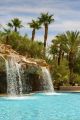 Waterfall In A Pool And Palms Tree Canvas Print